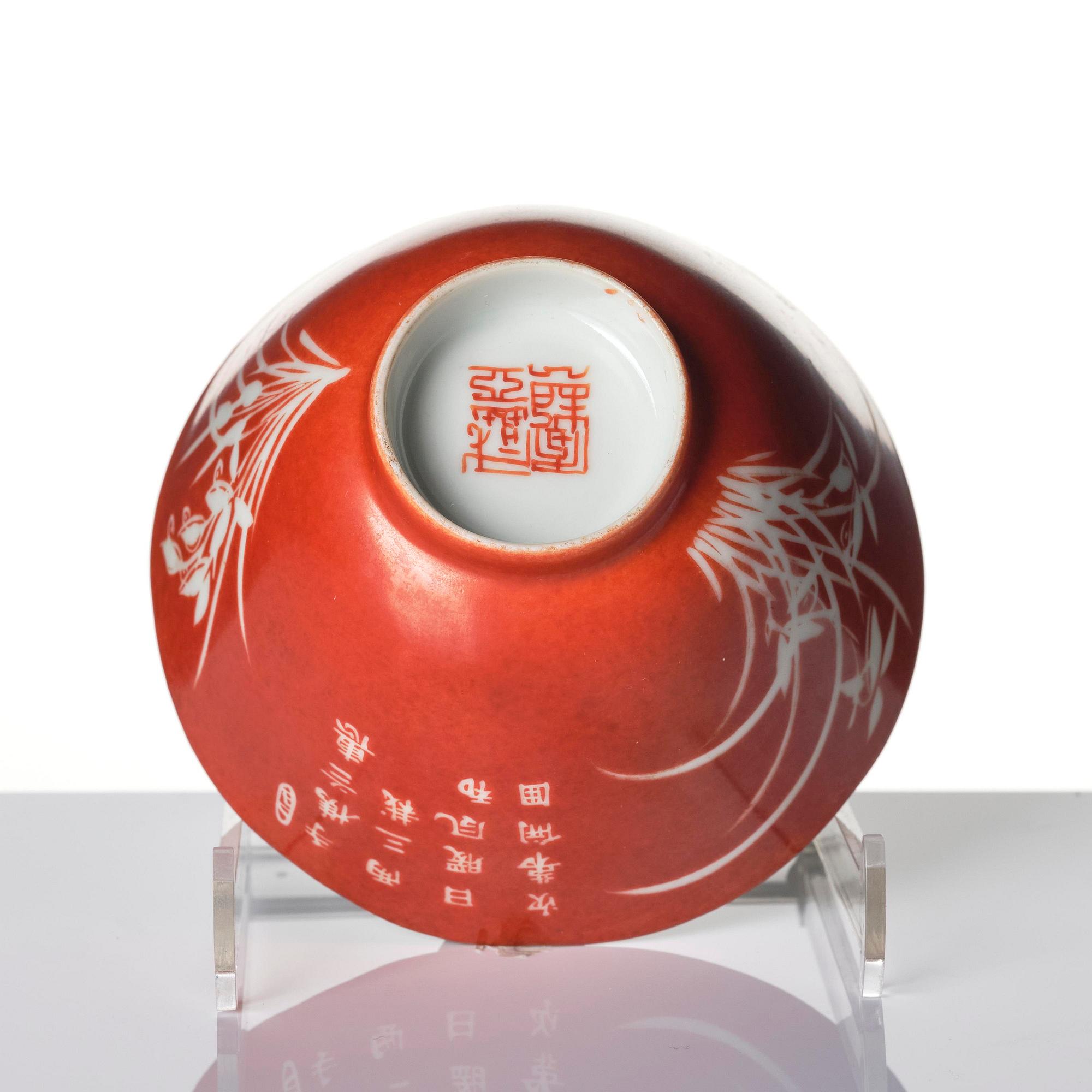 A coral-ground reserve decorated 'orchids' cup, late Qing dynasty.