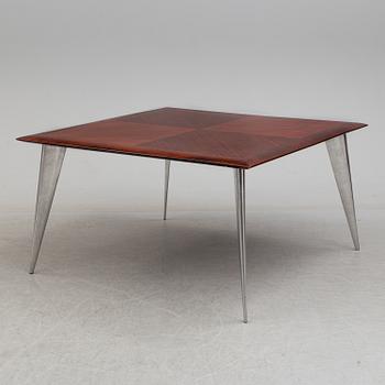 a dining table by Philippe Starck, "M Serie Lang", Driad.