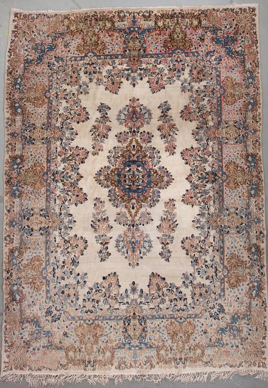 A Kerman carpet, around 360 x 262 cm.