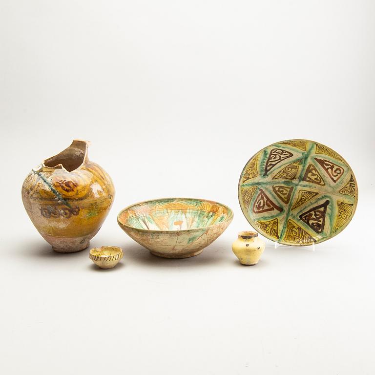 A group of Persian ceramics, some Nishapur-style Sgrafitto. (5 pieces).