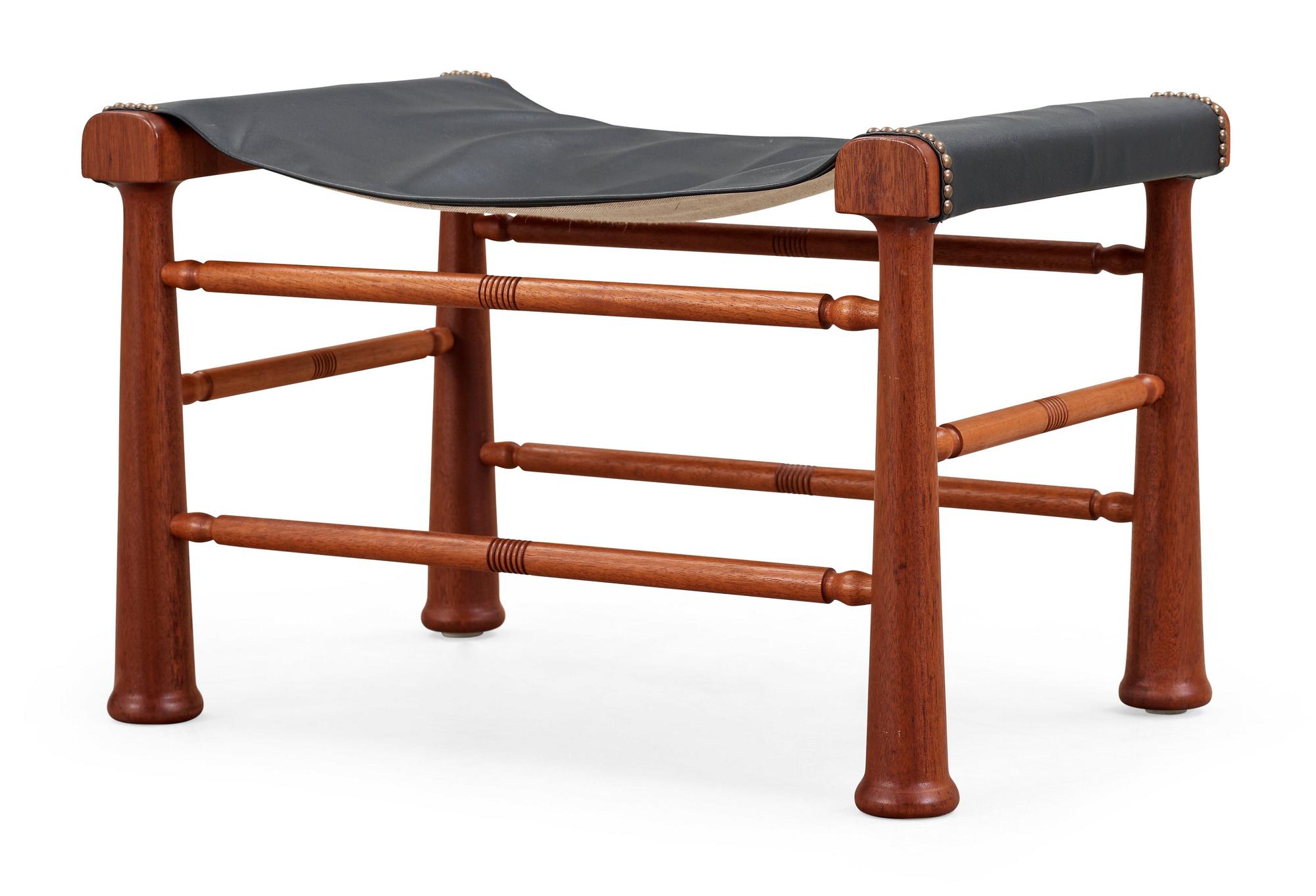 A Josef Frank mahogany and black leather stool, Svenskt Tenn, model 972.