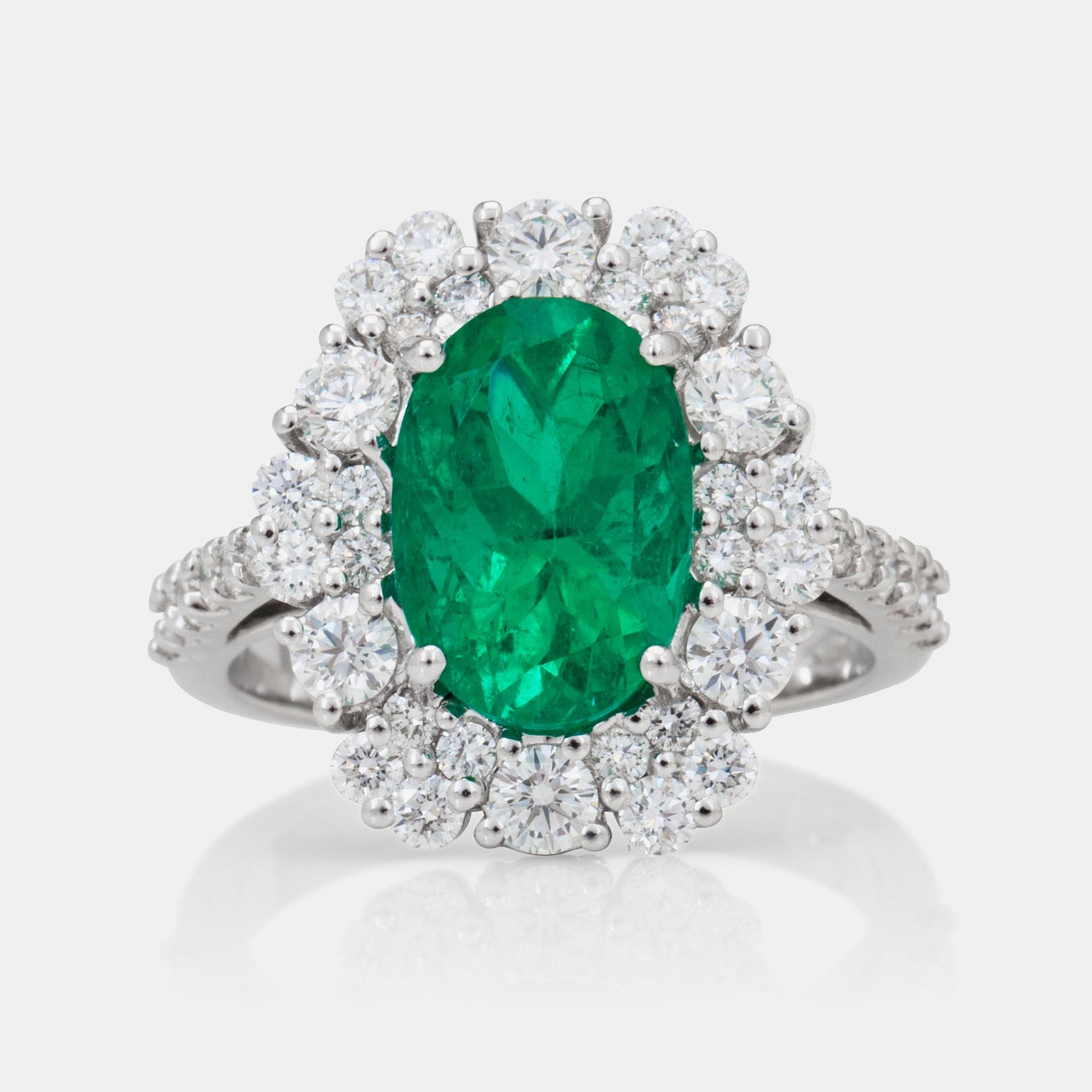 A 3.32ct Colombian emerald 'minor oil' and brilliant-cut diamond ring.