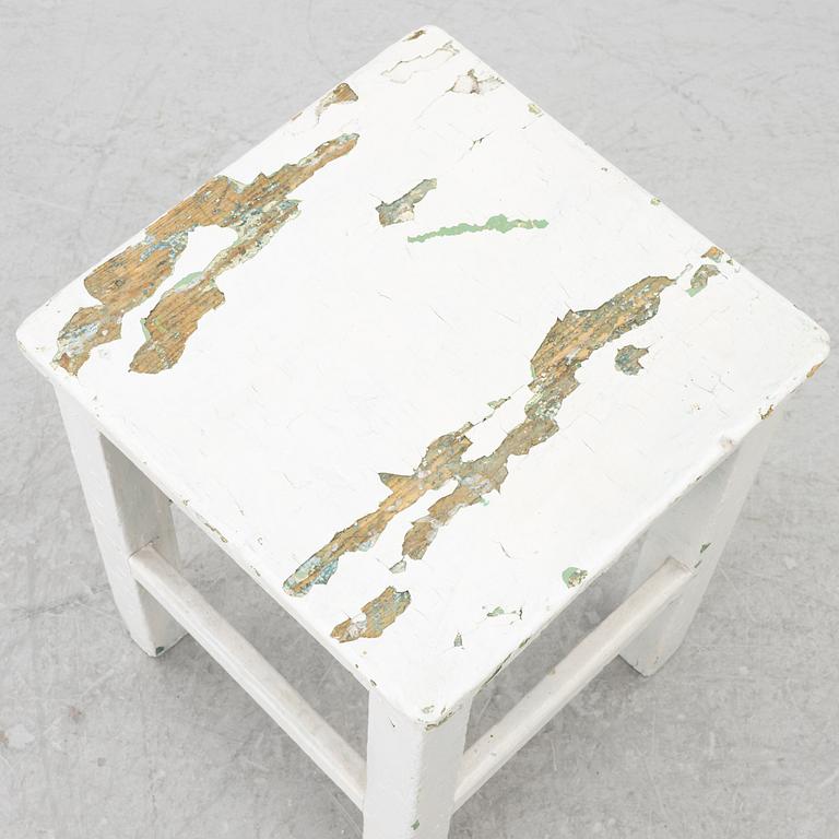 A table with stools, 20th/21st century.