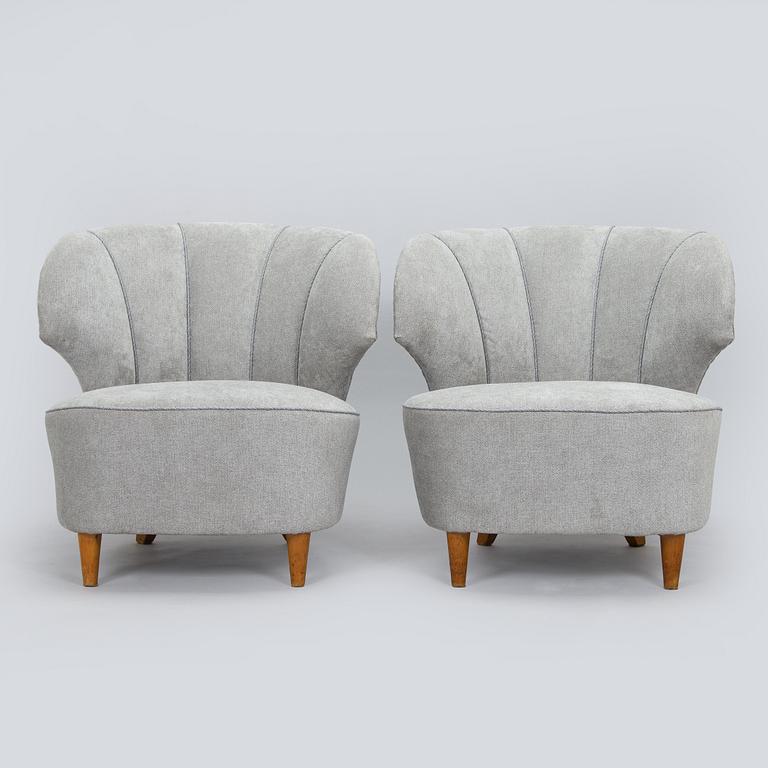 A pair of mid 20th century armchairs.