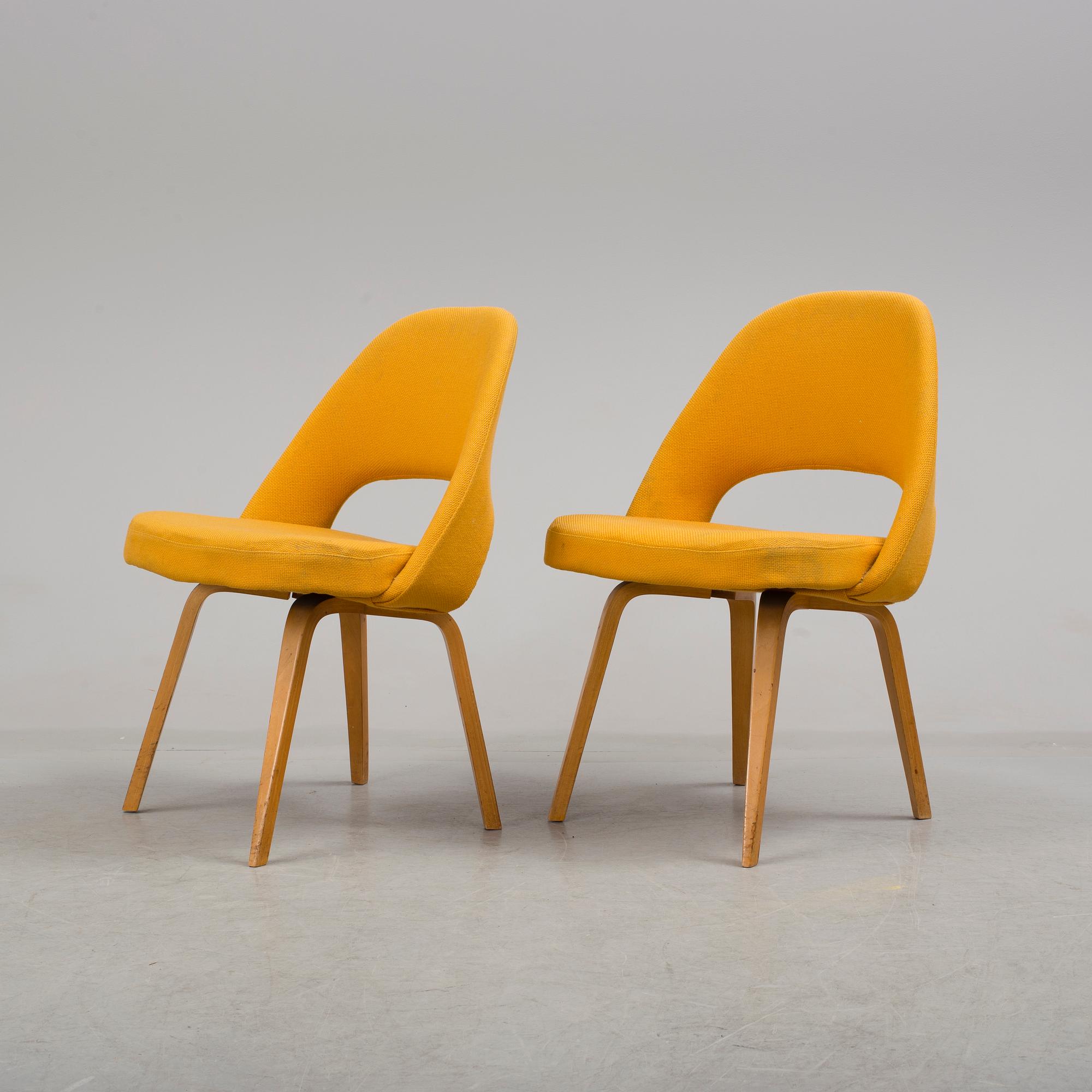 A group eight of Eero Saarinen executive side chair with wood legs, Knoll Products inc.