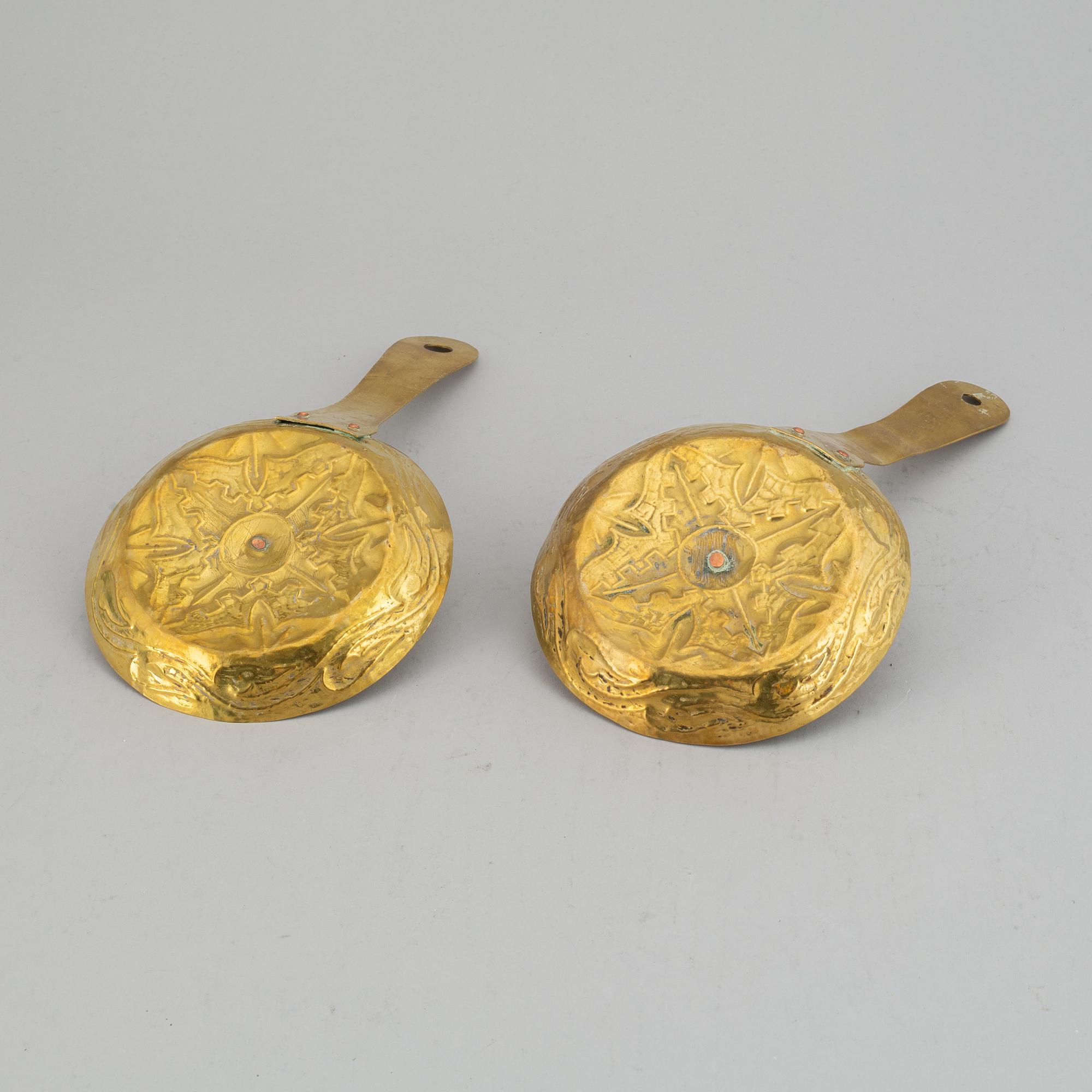 A pair of 19th century brass night light holders.