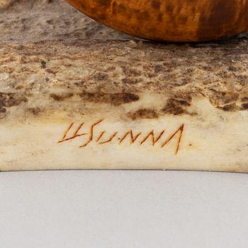 Lars Levi Sunna, a grouse reindeer horn and birch figurine, signed LL Sunna.