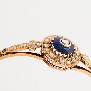 A blue paste and rose cut bangle, 19th century.