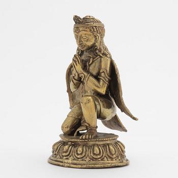 A copper alloy figure of bewinged dignitary, Nepal, 20th Century.