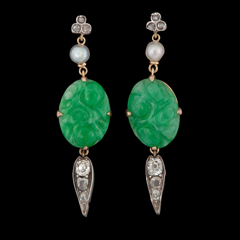 A pair of carved untreated jadeite, pearl and diamond earrings. Total carat weight of diamonds circa 0.40 ct.