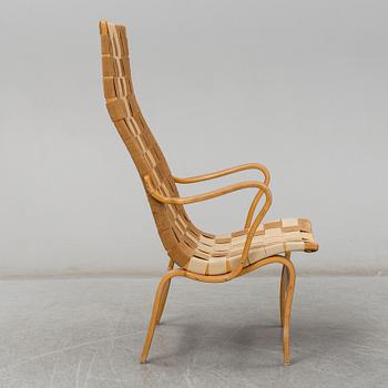 A armchair, model "Eva hög", designed by Bruno Mathsson for Firma Karl Mathsson, dated 1941.