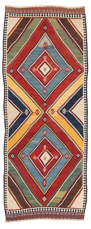 An antique Qashqai kilim rug, c. 380 x 148 cm.