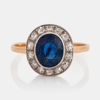 866. An 18K gold ring set with a faceted sapphire weight ca 2.00 cts and old-cut diamonds.