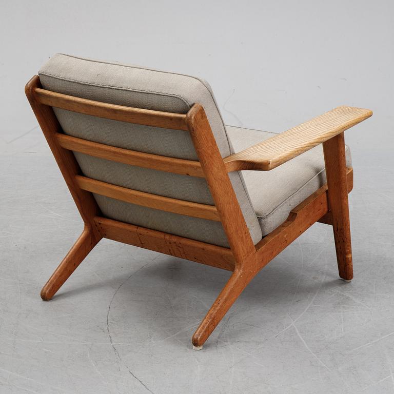 Hans J Wegner, an oak "'GE-290" easy chair from Getama, Denmark.