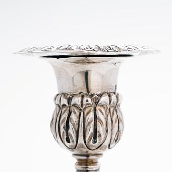 A pair of Russian silver candlesticks, maker's mark of Carl Johan Heyne, Saint Petersburg 1825.