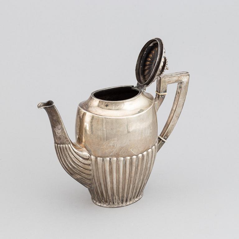 A silver coffee pot, creamer and sugar bowl, AG Dufva, Stockholm 1914.