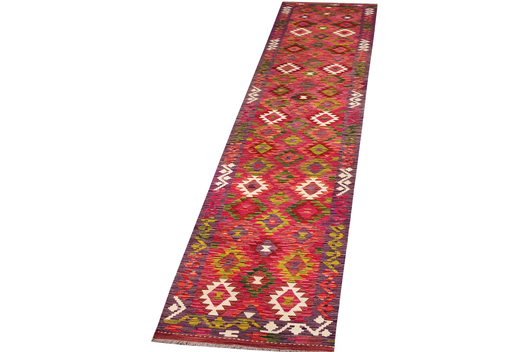 A Kilim runner carpet, c. 489 x 80 cm.