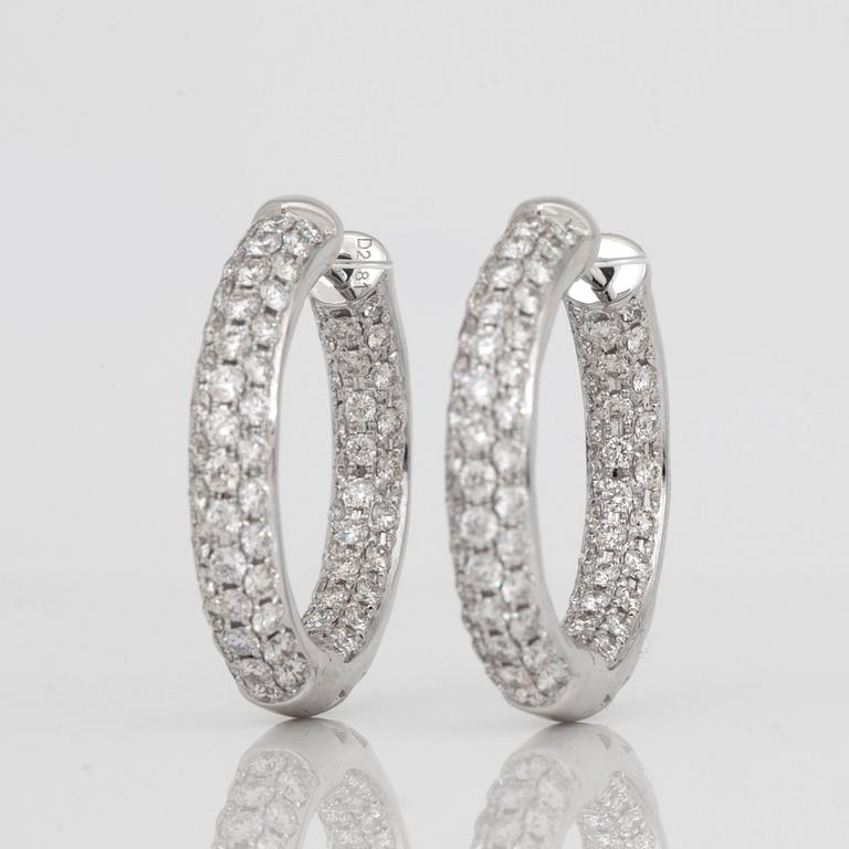 A pair of brilliant-cut diamond, 2.48 cts according to engraving, loop earrings.