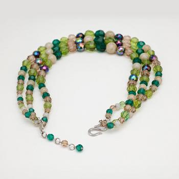 CHRISTIAN DIOR, a green three strand glass beaded necklace.