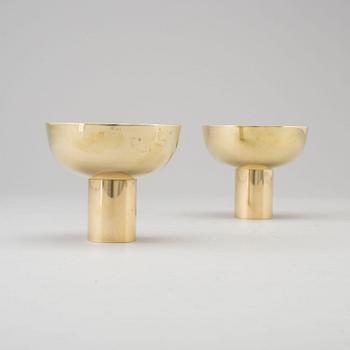 a pair of brass candle lights by Sigurd Persson.