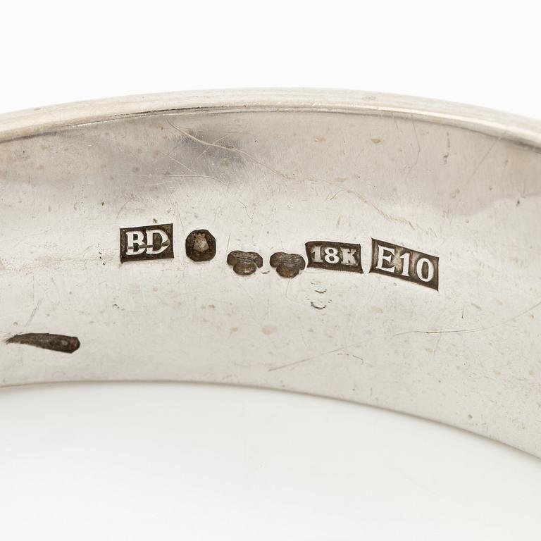 Aftonklocka/armring, Bo Dolk, 18K vitguld med briljantslipade diamanter, 1970-tal.