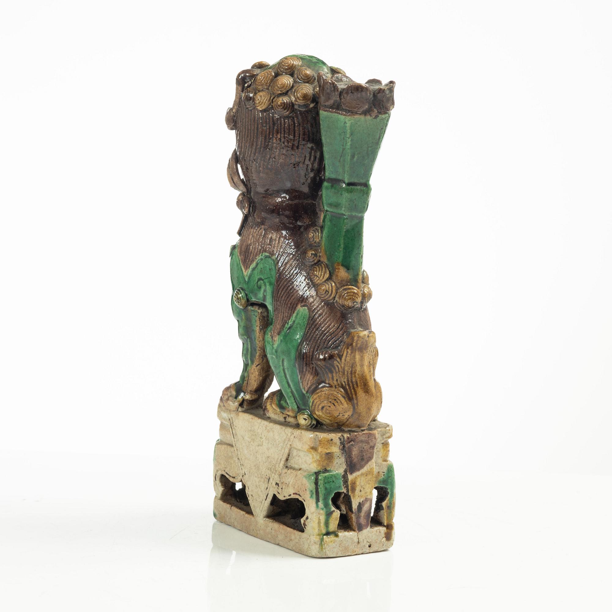 A Sancai glazed Buddhist lion incense/joss stick holder, Qing dynasty, Kangxi (1662-1722).