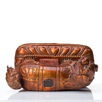 A cold gilt and lacquered copper alloy sculpture of a buddhist lion, Tibeto-Chinese/Mongolian, 18th Century.