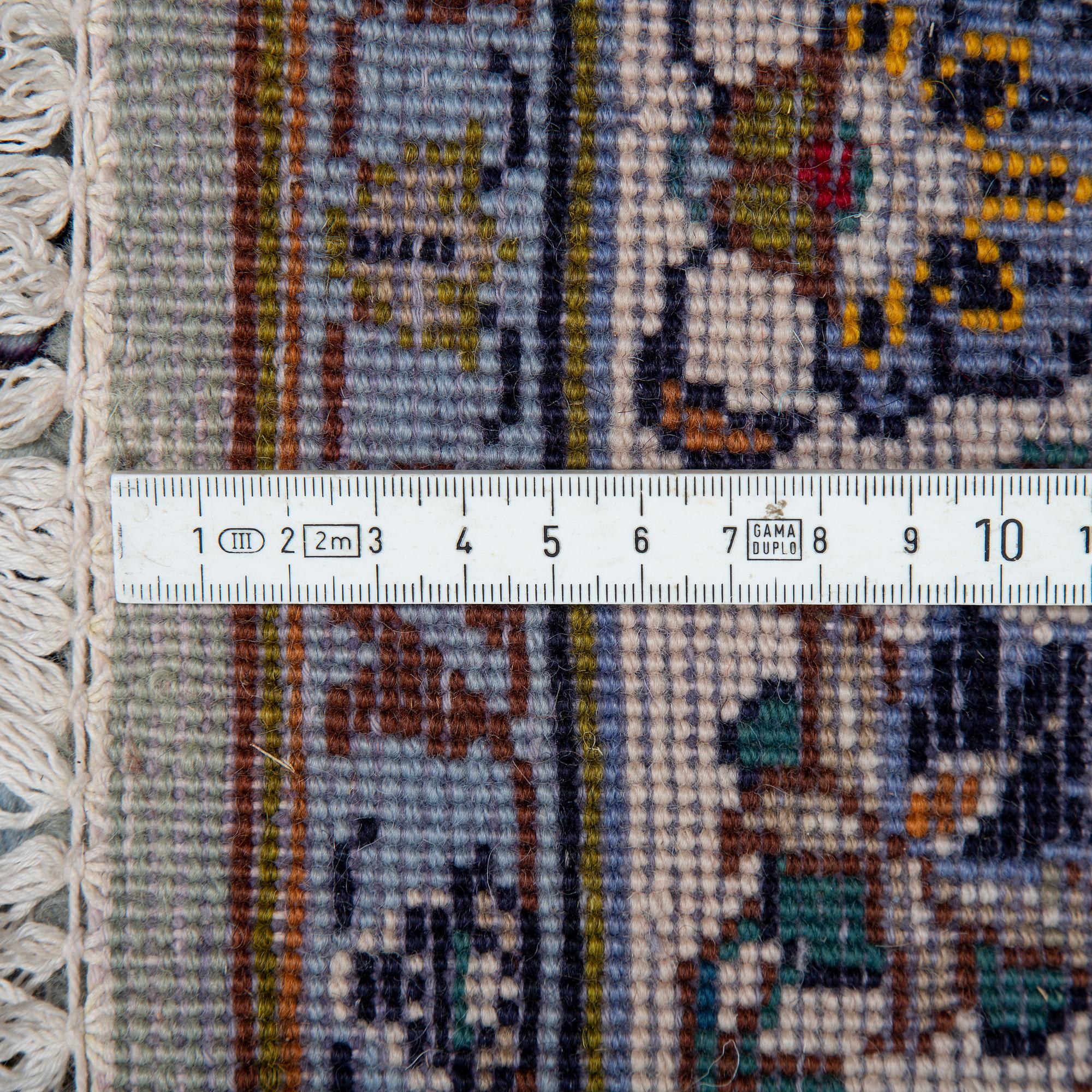 A carpet, an old Kashan, ca 554,5 x 351,5-358 cm, an inscription: Kashan Tavasoli.