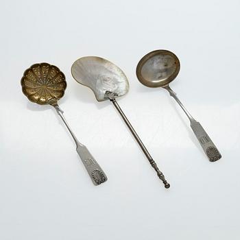 A pair of Russian silver salt cellars, a sprinkle spoon, a sauce ladle, and a tea strainer, Finnish marks.