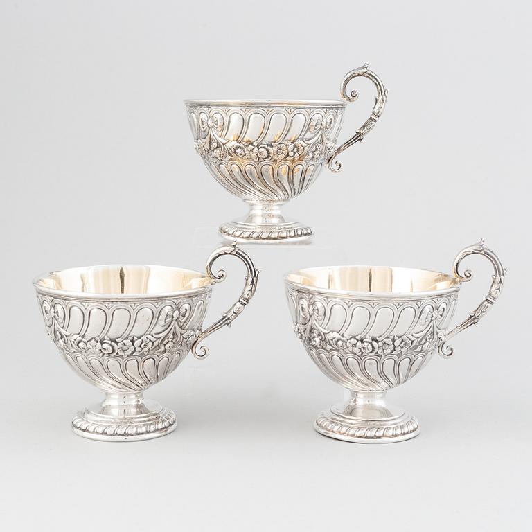 Three parcel-gilt silver chocolat-cups, mark of CG Hallberg, Stockholm 1896. Louis XVI-style.