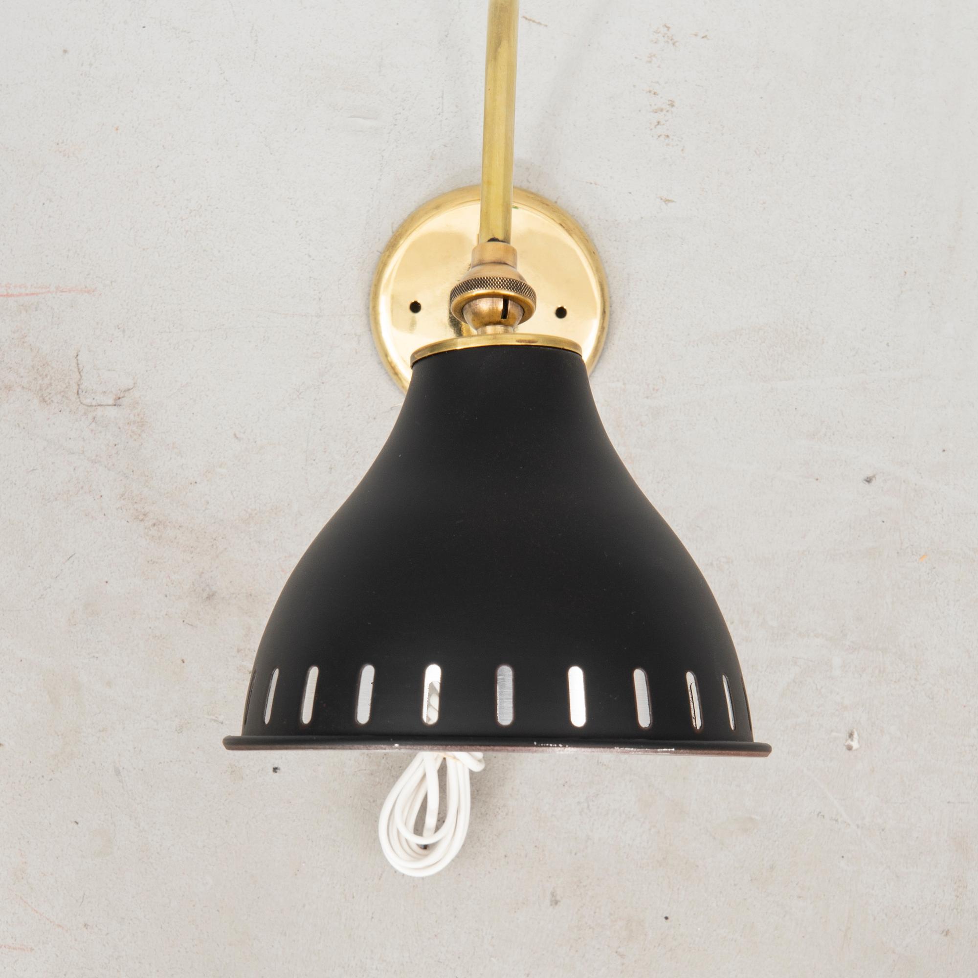 A bras wall lamp later part of the 20th century.