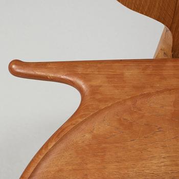 A Hans J Wegner 'Jakkens Hvile' teak chair, Johannes Hansen, Denmark.