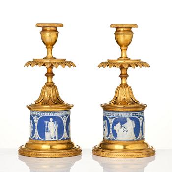 A pair of George III ormolu and jasperware candlesticks, late 18th century.