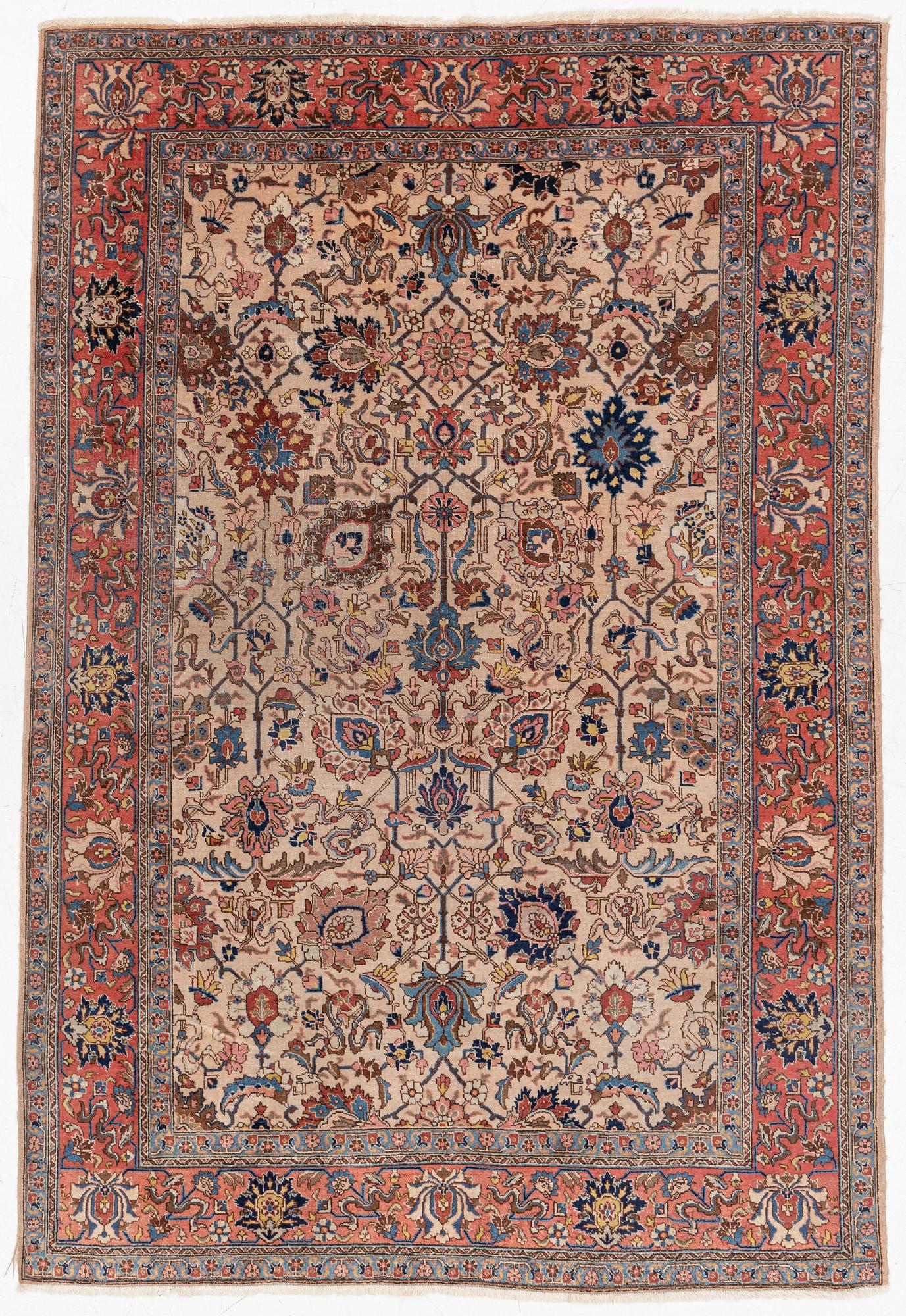 A semi antique Tabriz carpet, c. 290 x 195 cm.
