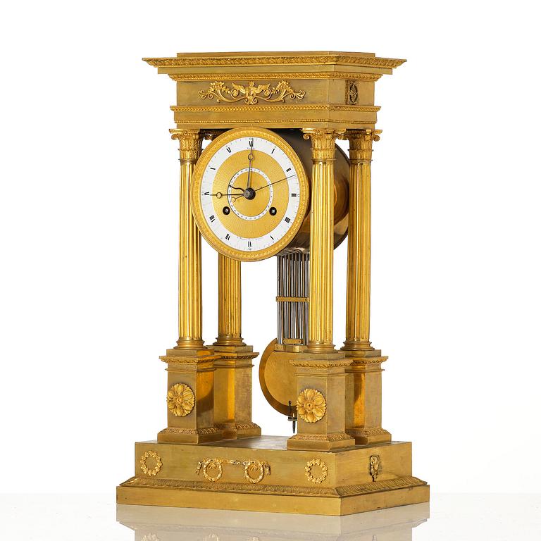 An Empire ormolu portico clock by Louis Bausse (watchmaker in Paris ca. 1807-24).