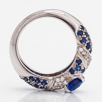 An 18K white gold ring, with diamonds totalling approximately 0.22 ct and sapphires.