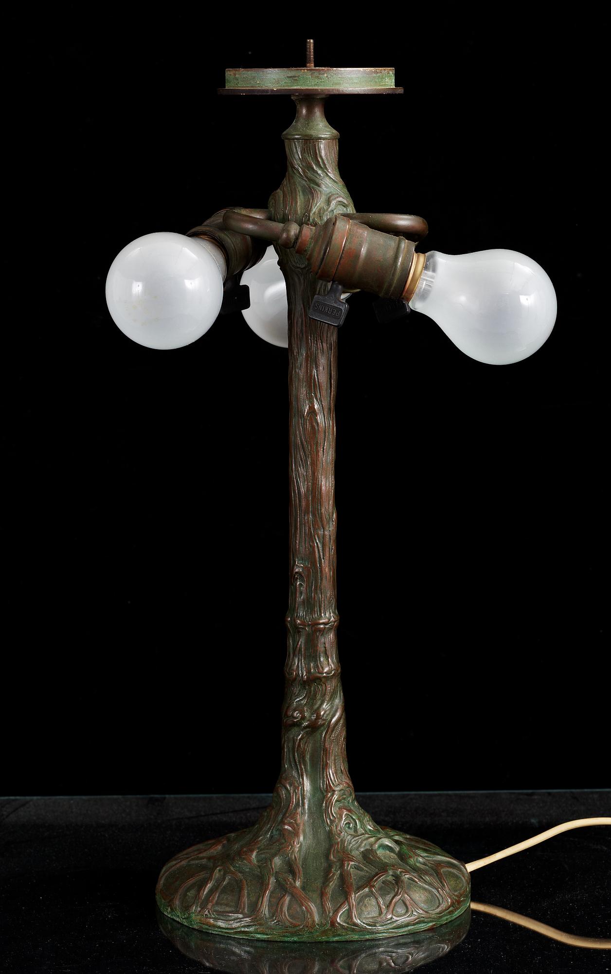 A Tiffany Studios Art Nouveau 'Daffodils' bronze base table lamp, New York circa 1910-15.