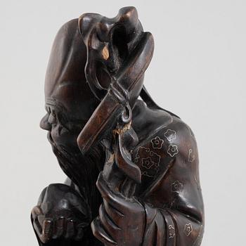 A Chinese wooden figure of 'Shoulao' with silver inlays, 20th century.