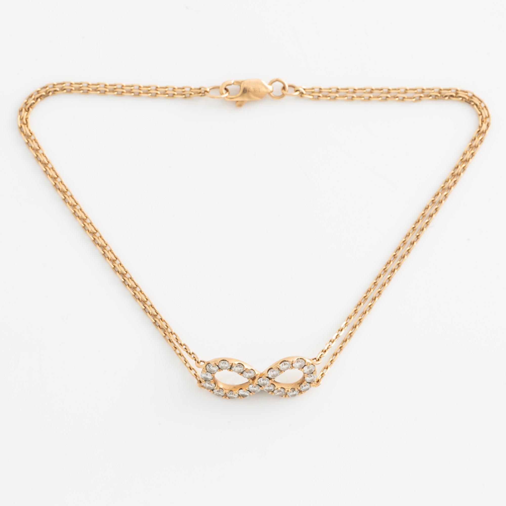 Armband, 18K guld med briljantslipade diamanter.