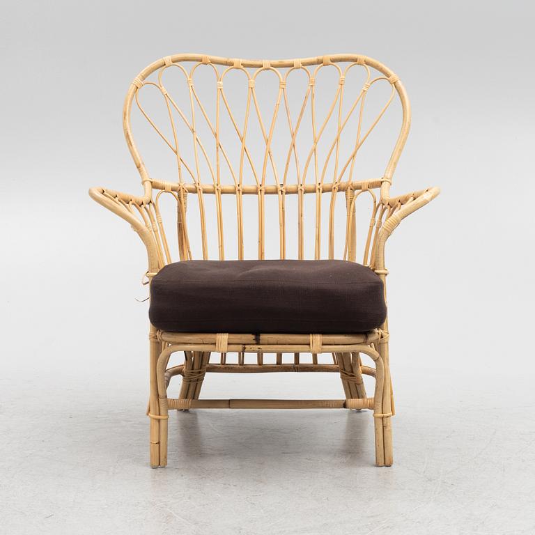 Josef Frank, a model 311 rattan armchair, Firma Svenskt Tenn.