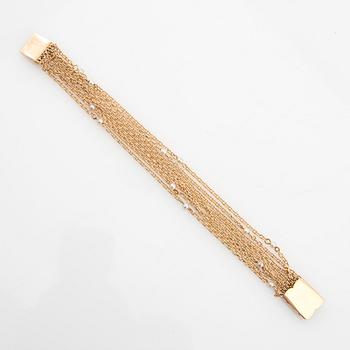 Bracelet 18K gold and seed pearls.