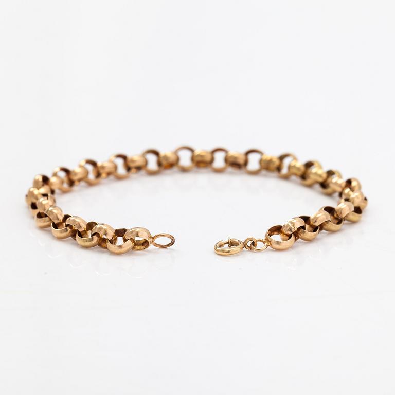A 14K gold bracelet.