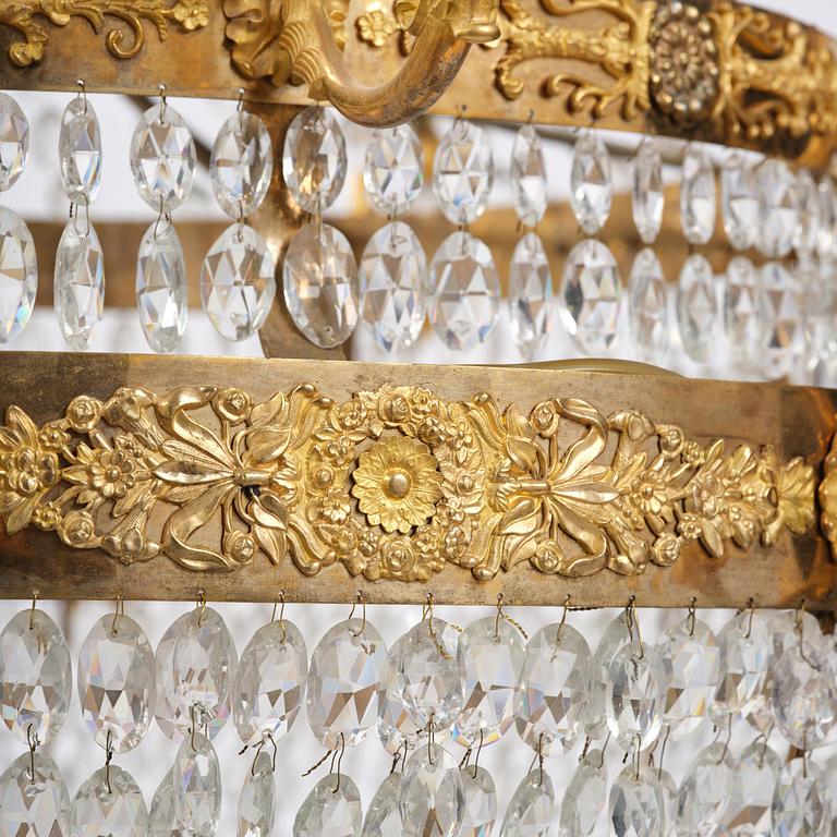 An ormolu and cut glass sixteen-branch Empire chandelier, Paris, early 19th century.