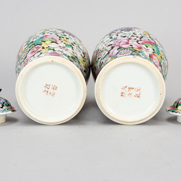 A pair of Chinese 'Mille fleur' porcelain vases with covers, 20th century.
