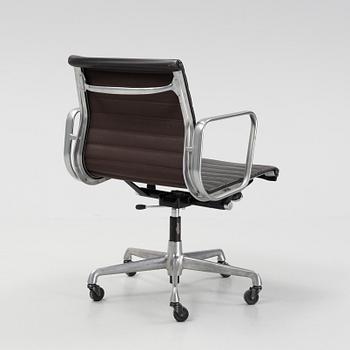 An EA 118 swivel office chair by  Charles and Ray Eames for Herman Miller, designed 1958.