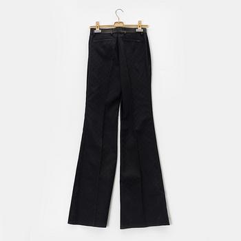 Gucci, a pair of logo pants, size 38.