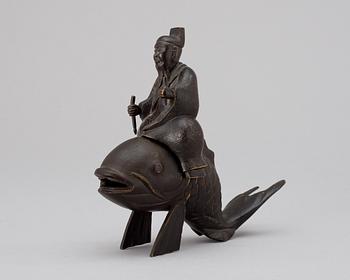 A Japanese Meiji bronze figure, Kinko on a carp.