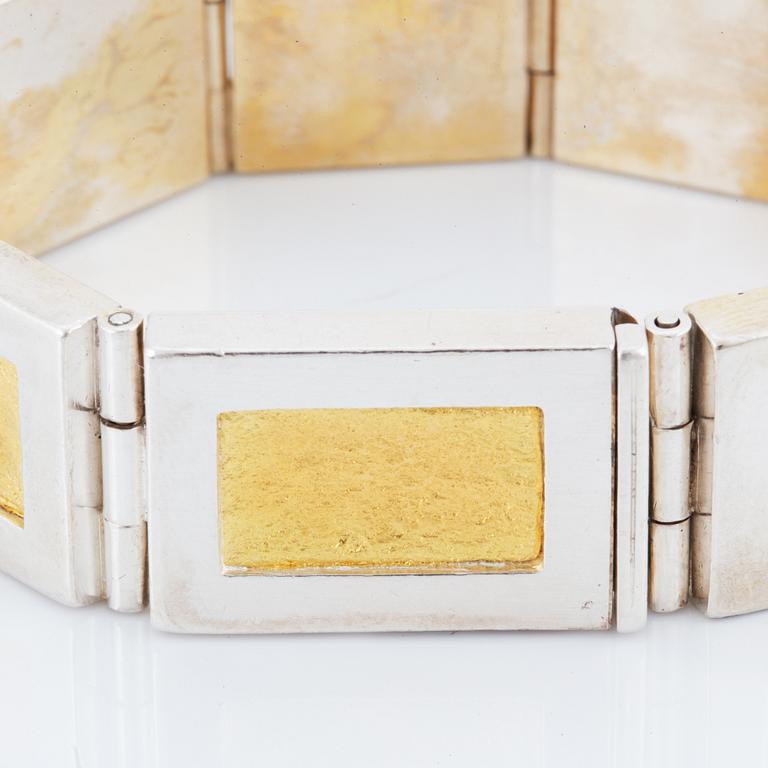 A Michael Hamma bracelet in silver and 18K gold.