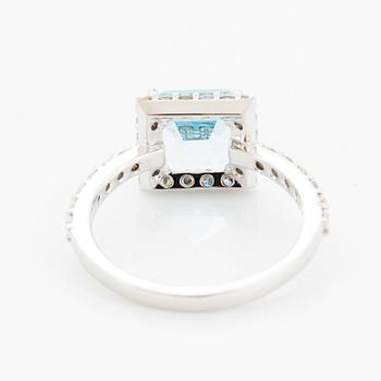 Blue topaz and brilliant-cut diamond ring.