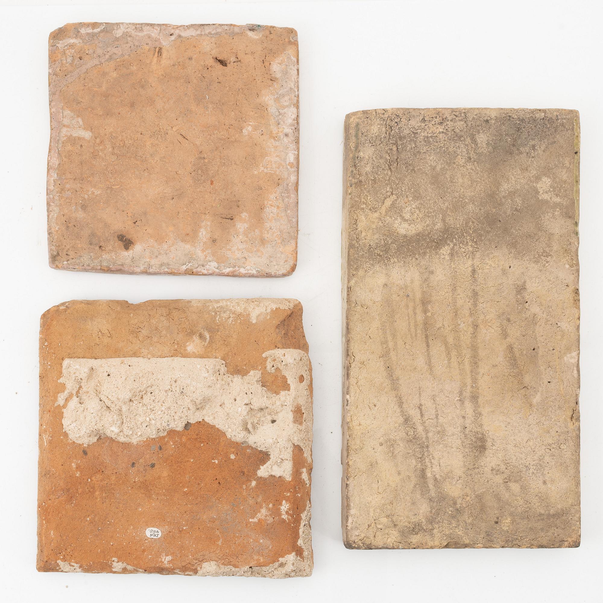A group of three Persian (Iranian) tiles, glazed pottery, Qajar dynasty, 19th century.